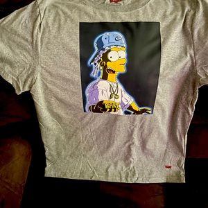 White Levi’s shirt with a cartoon character on it